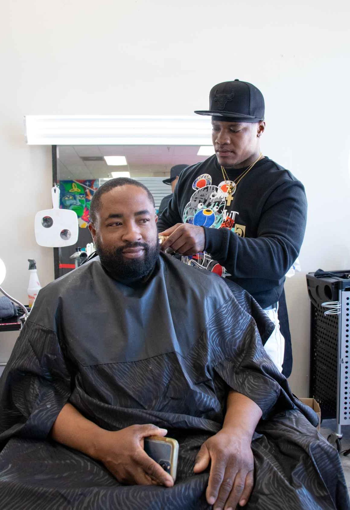 A man gets a haircut at ColoradoSpringsWorks as part of ACLU of Colorado's voter engagement event on October 29, 2022.